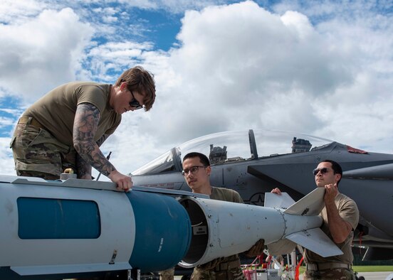 Airmen from the 4th Munitions Squadron assemble 
a Guided Bomb Unit-31 during a quarterly load crew competition at Seymour Johnson Air Force Base, North Carolina, July 10, 2020.