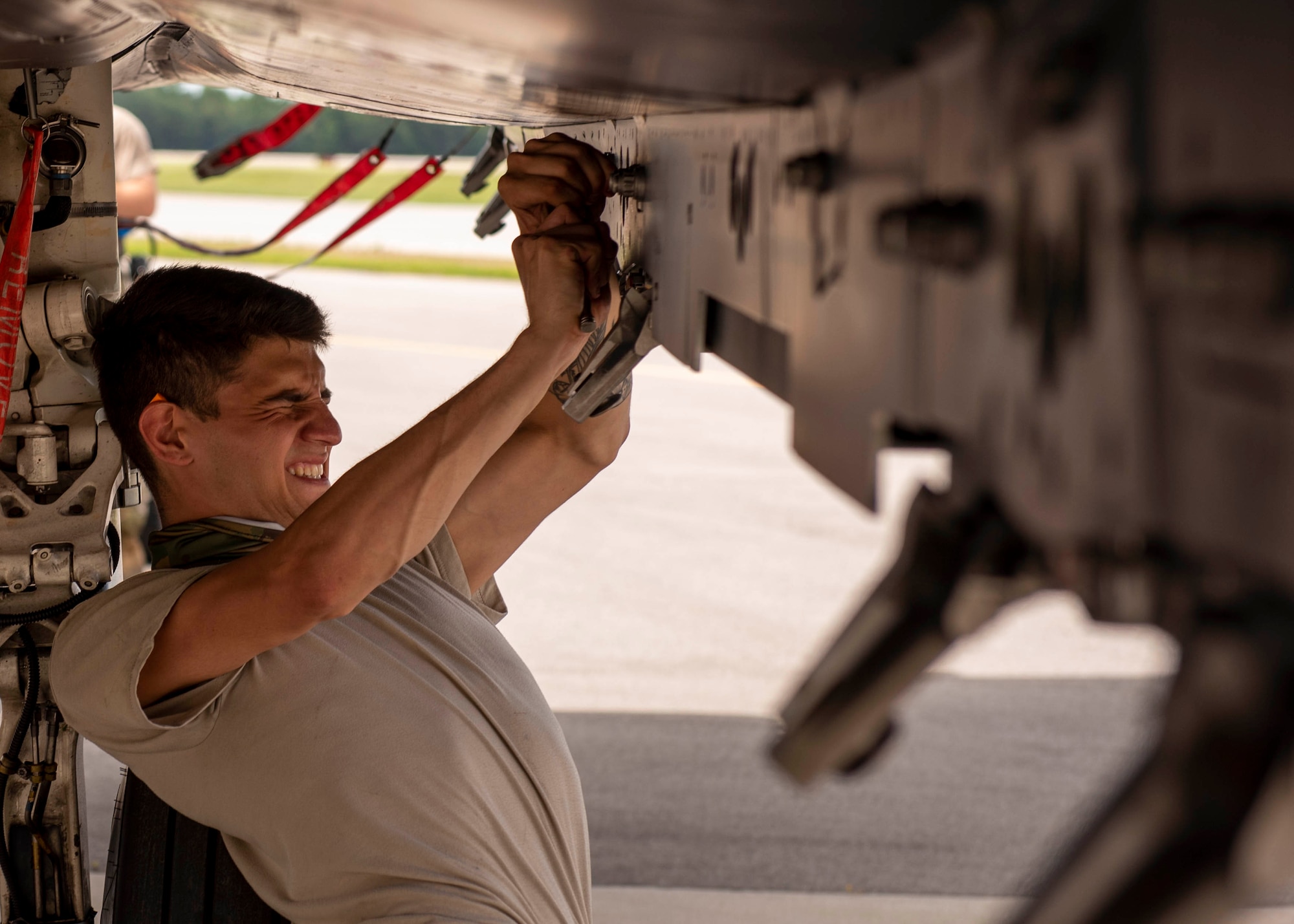 Airman 1st Class Elijah Nolan, 333rd Aircraft Maintenance Unit weapons load crew member, prepares the weapons rack of an F-15E Strike Eagle at Seymour Johnson Air Force Base, North Carolina, July 10, 2020.