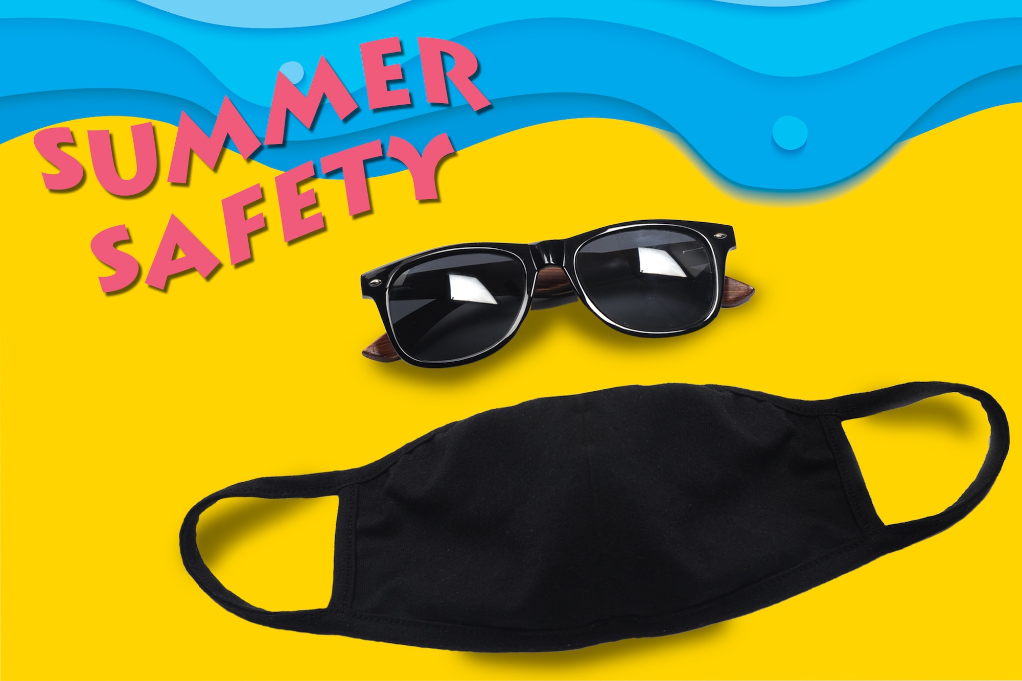 A summer safety graphic. The top of the image is a blue wave. The bottom is yellow sand. There is a diagonal title Summer Safety in the top left corner. There is a black pair of glasses and a black mask over the yellow sand.