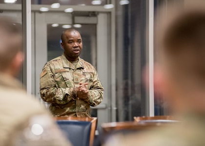 Capt. Robert Gaygay, 138th Medical Group, speaks with Airmen at the Tulsa Air National Guard Base, Oklahoma, April 23, 2020. In response to the COVID-19 outbreak, 25 Airmen from the 138th FW are working with the Tulsa Food Bank to provide support including receiving, packing and transporting food, as well as completing inventory food bank supplies. (Oklahoma Air National Guard photo by Tech. Sgt. Rebecca Imwalle)