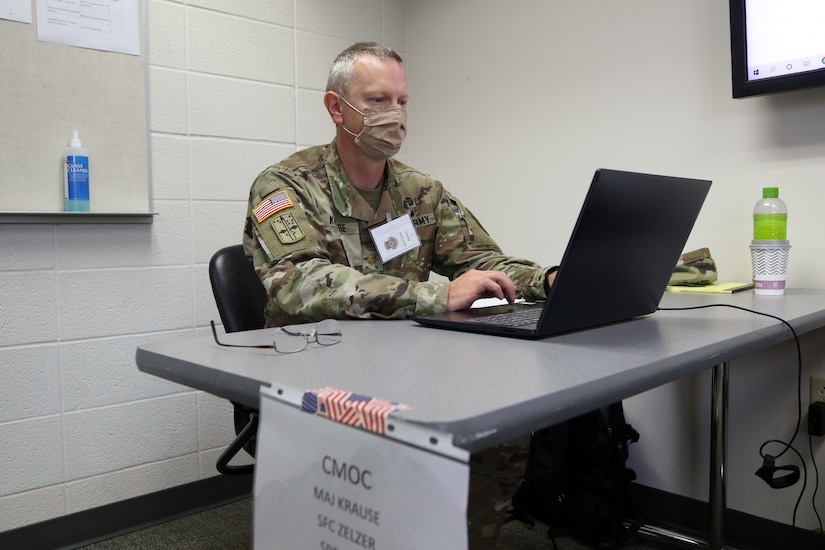 Major Tim Krause, the civil military operations center officer in charge, Charlie Company, 432nd Civil Affairs Battalion, 308th Civil Affairs Brigade, reviews information about a fictional region during a cumulative training exercise at Fort McCoy, Wis., July 14, 2020. Krause and other members of the 432nd CA Bn., are preparing for an upcoming mobilization overseas later this year.