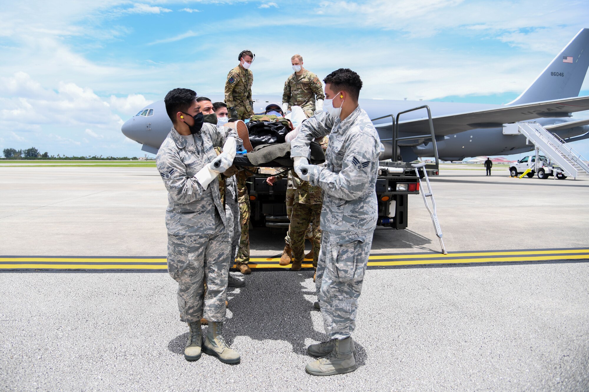 Airmen from the 45th Operational Medical Readiness Squadron, offload a patient July 10, 2020, at Patrick Air Force Base, Florida. The patients had recently returned from overseas to their home stations for follow-on care. (U.S. Air Force photo by Airman 1st Class Nilsa Garcia)