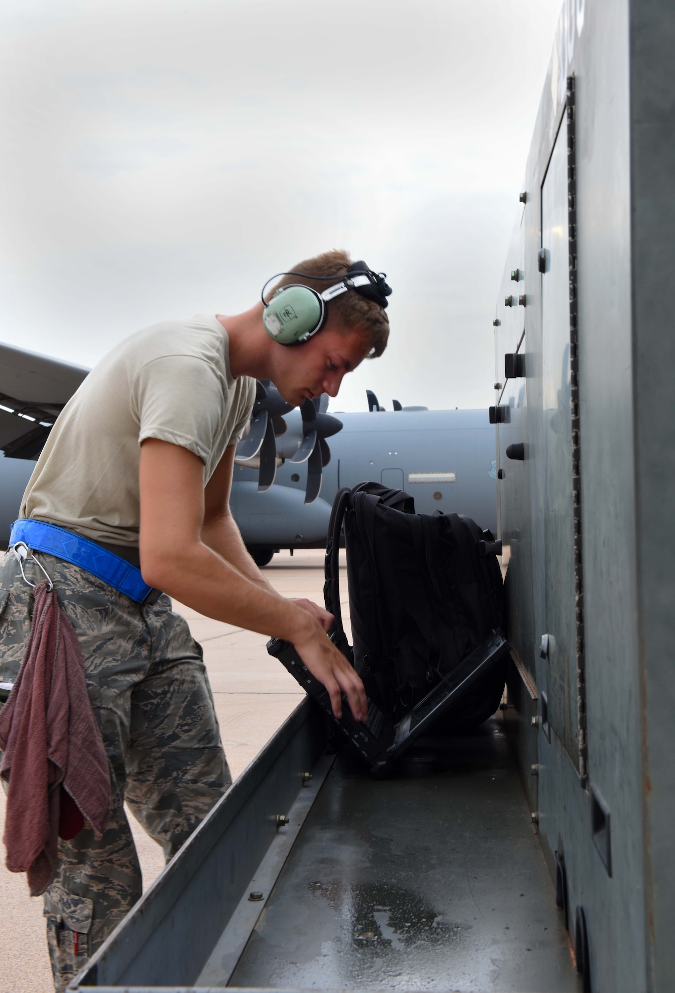 Airman 1st Class Jordan Diehl, 317th Aircraft Maintenance Squadron crew chief, reviews C-130J Super Hercules aircraft technical orders during pre-flight operations at Dyess Air Force Base, Texas, July 14, 2020.