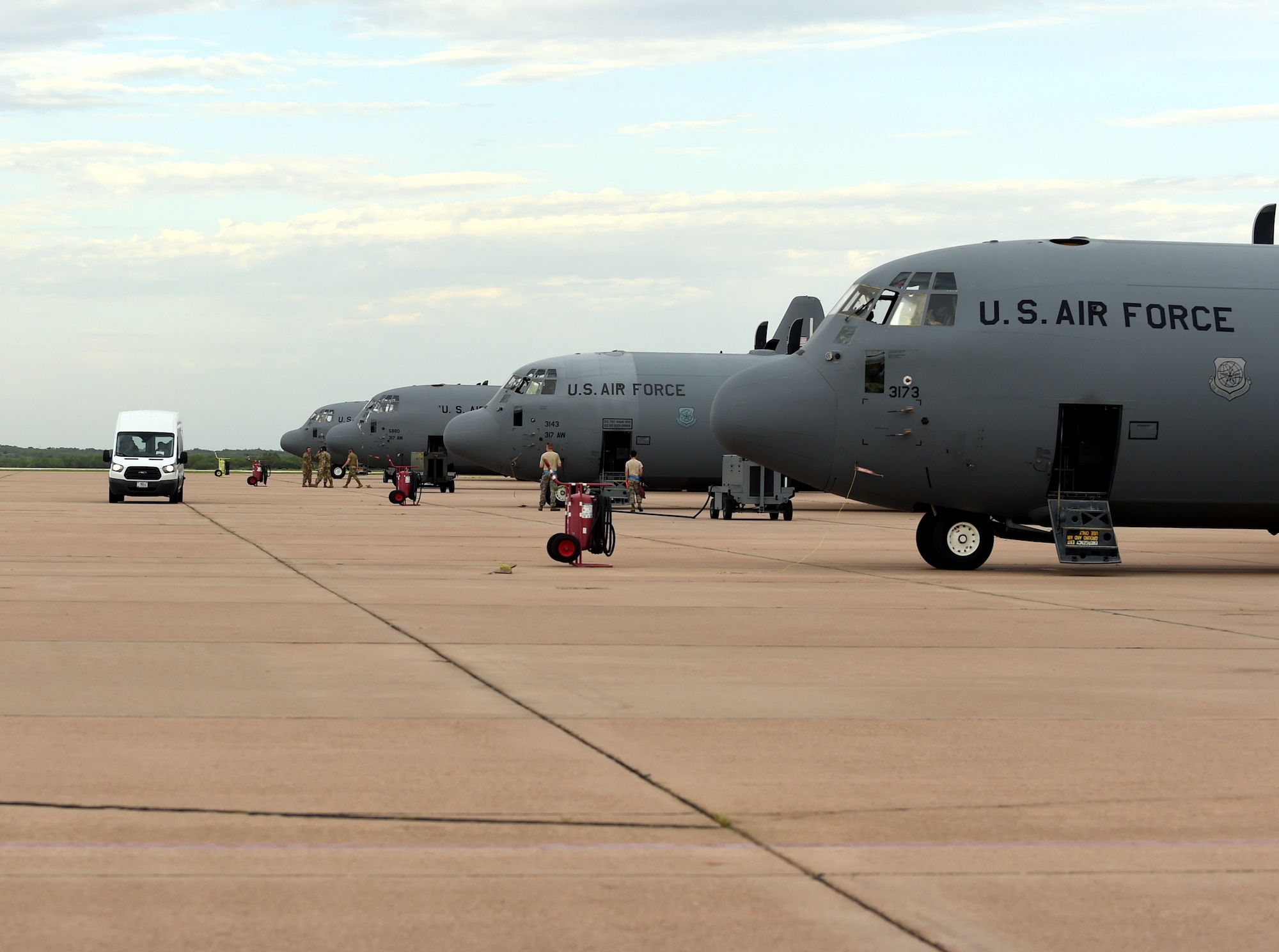 Maintainers and aircrew from the 317th Airlift Wing prepare C-130J Super Hercules aircraft participating in a Joint Forcible Entry exercise at Dyess Air Force Base, Texas, July 14, 2020.