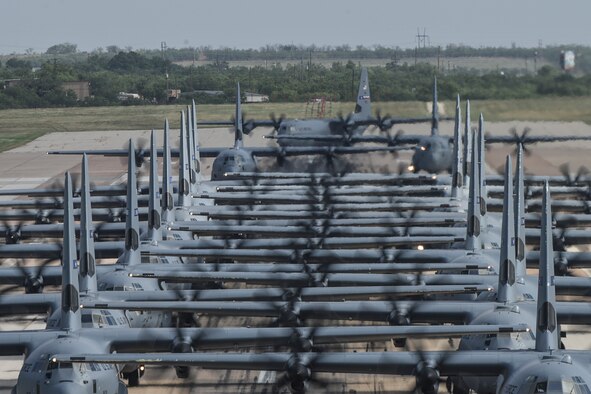 Capt. Justin Harrington and Capt. Maddie Atkinson, 41st Airlift Squadron pilots, prepare for crew briefs before the Herk Nation Stampede at Little Rock Air Force Base, Arkansas, July 14, 2020.