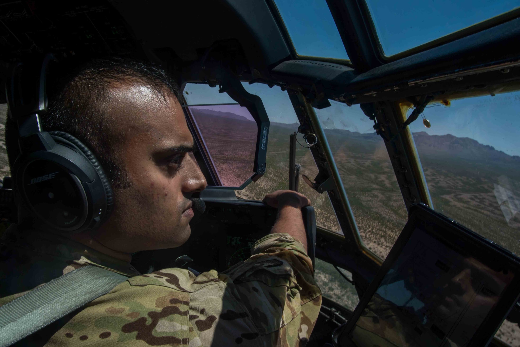 Maj. Darshan Subramanian, 317th Airlift Wing pilot, scans the horizon for hazards during a Joint Forcible Entry exercise July 14, 2020, at Dyess Air Force Base, Texas.