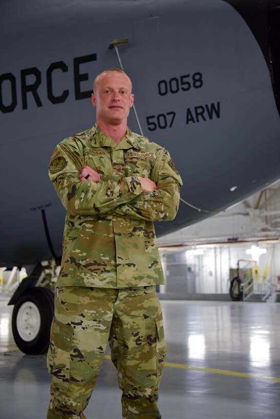 Man stands in front of jet