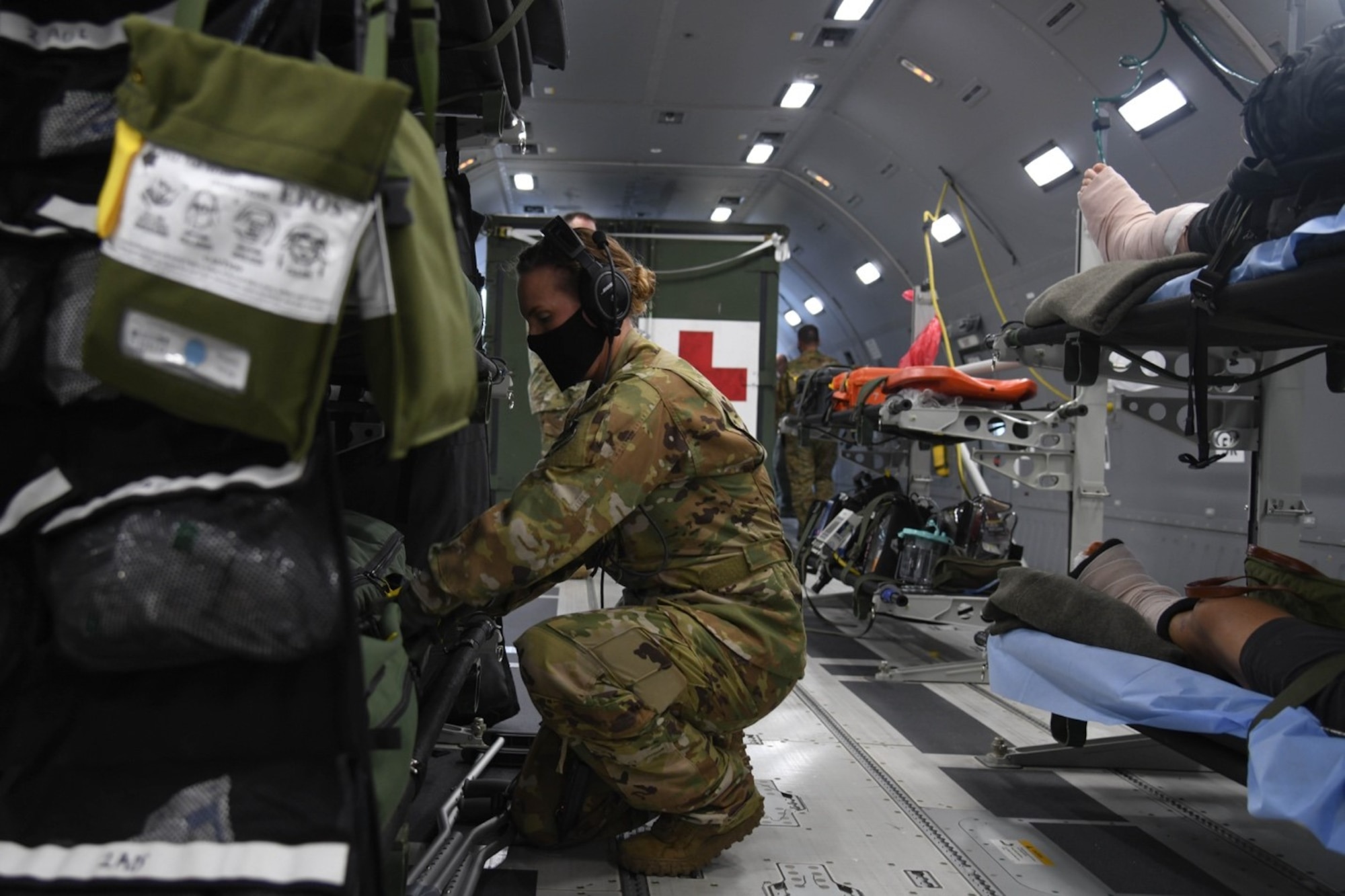 Master Sgt. Jaclyn Klimaski, Air Mobility Command aeromedical evacuation technician assigned to Air Mobility Command Headquarters at Scott Air Force Base, Illinois searches for equipment in an inflight kit July 10, 2020, at Joint Base Andrews, Maryland. In support of this Initial Operational Test and Evaluation, the Total Force AE crew qualified on the KC-46A Pegasus using a syllabus that included numerous patient scenarios and configurations to guide the execution of the training. (U.S. Air Force photo by Airman 1st Class Nilsa Garcia)