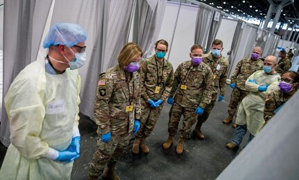 Lt. Gen. Laura Richardson (second from left), commander of U.S. Army North, views the patient area of the intensive care unit at the Javits New York Medical Station, April 12, 2020.