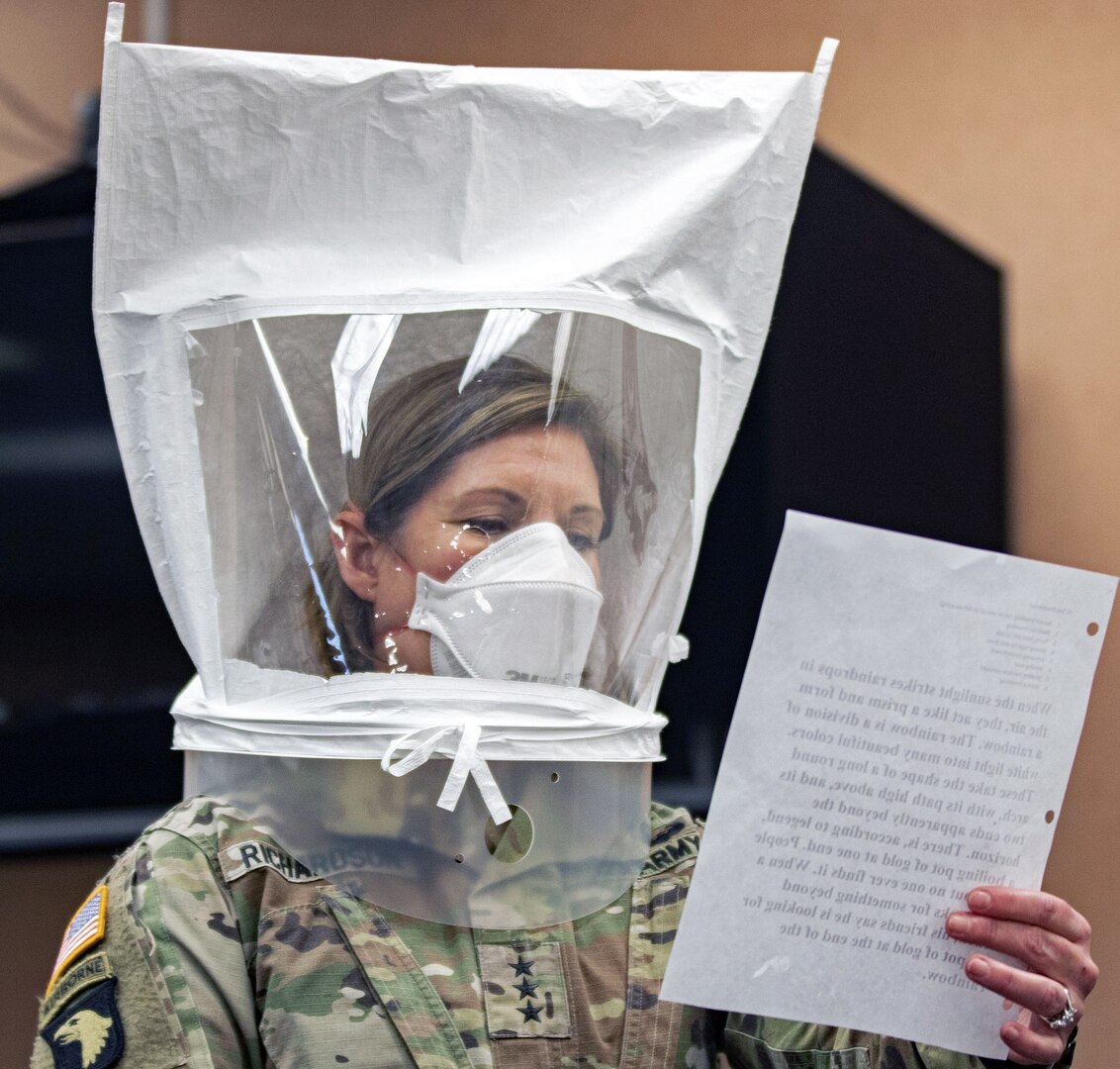 Lt. Gen. Laura Richardson, commander of U.S. Army North, goes through the safety precautions before entering the patient ward of the Edison Field Medical Site in Edison, N.J., April 13, 2020.