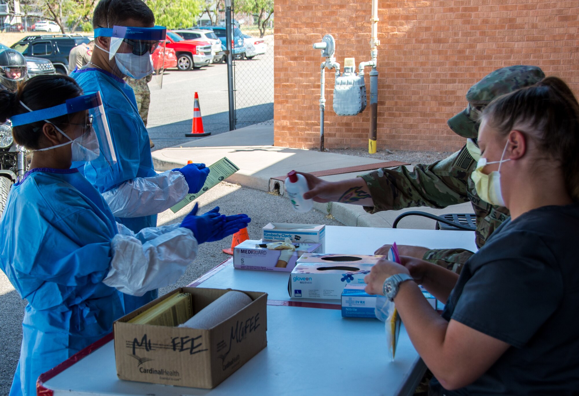 Guardsmen administer COVID-19 tests to fellow Texans.