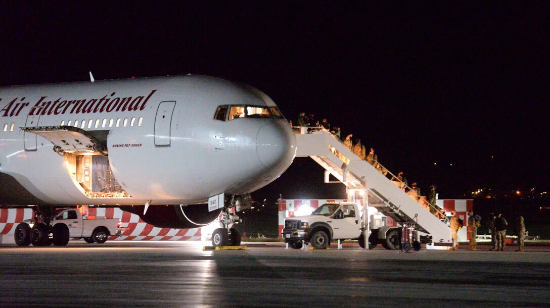 Airmen from the 28th Bomb Wing board a Boeing 767 at Ellsworth Air Force Base, S.D., for a Bomber Task Force deployment to the U.S. Indo-Pacific Command area of responsibility July 14, 2020. During the deployment, approximately 170 Airmen and four B-1B Lancers assigned to the 37th Bomb Squadron will conduct missions in the USINDOPACOM arena aimed at maintaining global stability and security in the region. (U.S. Air Force photo by Airman Quentin K. Marx)
