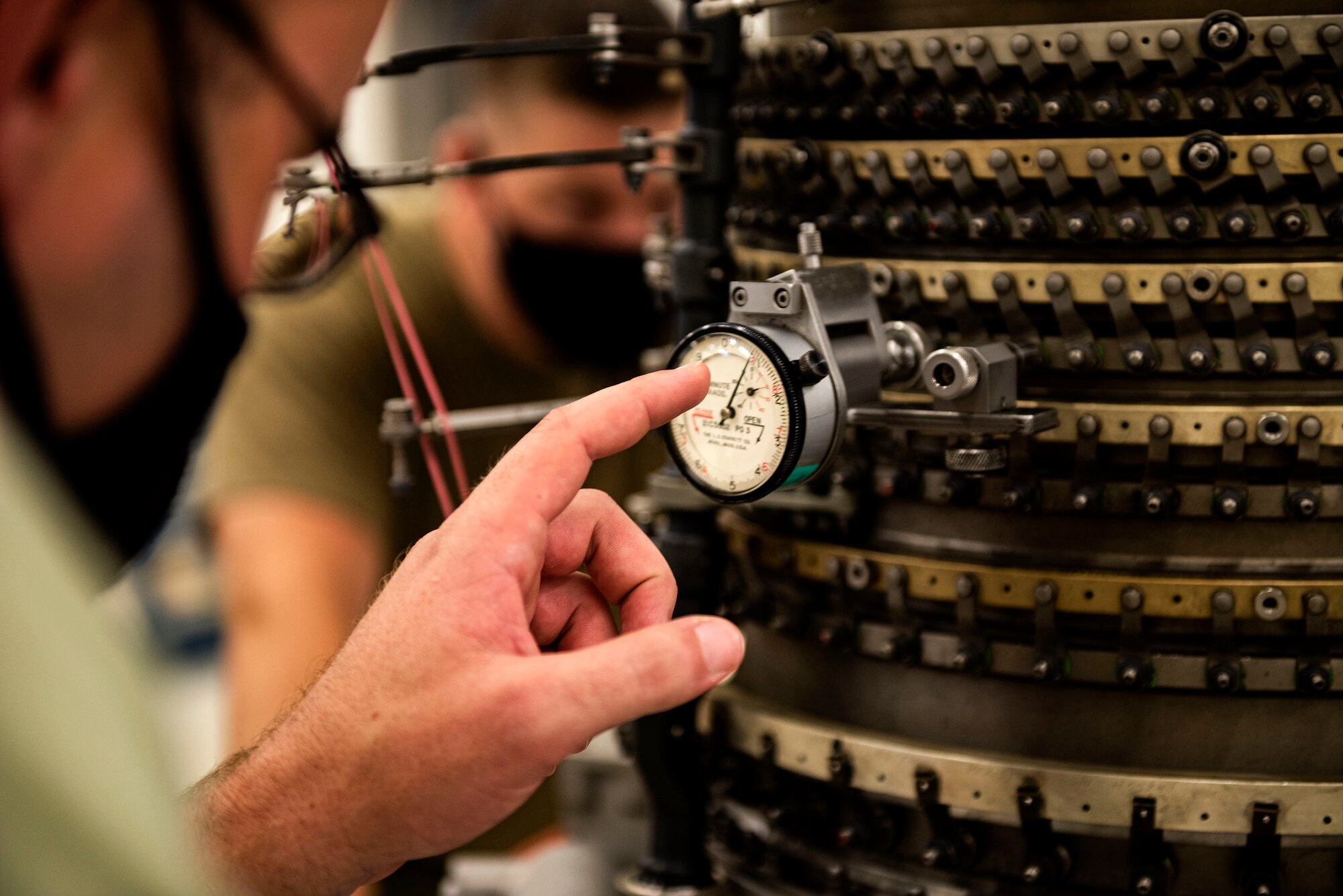 Photo of Airmen working on a TF34 engine.