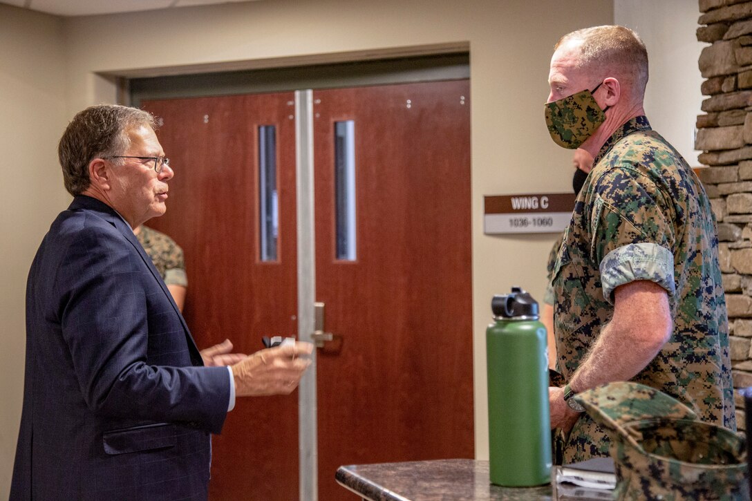 Charles A. Williams, Jr., left, assistant secretary of the Navy for Energy, Installations and Environment, discusses hurricane repairs with Maj. Gen. Edward D. Banta, commanding general, Marine Corps Installations Command, during a tour on Marine Corps Base Camp Lejeune, July 14, 2020. Williams and Banta visited MCB Camp Lejeune and Marine Corps Air Station New River to receive an update on military construction from installation leaders and view hurricane related repairs to facilities and family housing currently in progress. (U.S. Marine Corps photo by Cpl. Karina Lopezmata)