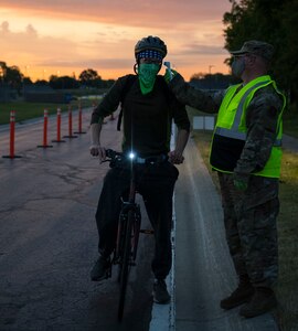 A U.S. Airman with the Indiana Air National Guard receives a temperature check while passing through a prescreening station June 14, 2020, at the 122nd Fighter Wing in Fort Wayne, Indiana. Temperature checks were conducted as an additional safety measure to help identify members with potential COVID-19 symptoms.