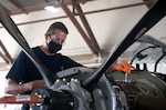 Roger Arredondo, T-6 Aircraft Maintenance Chief, conducts a regular aircraft control check at Joint Base San Antonio-Randolph July 14.