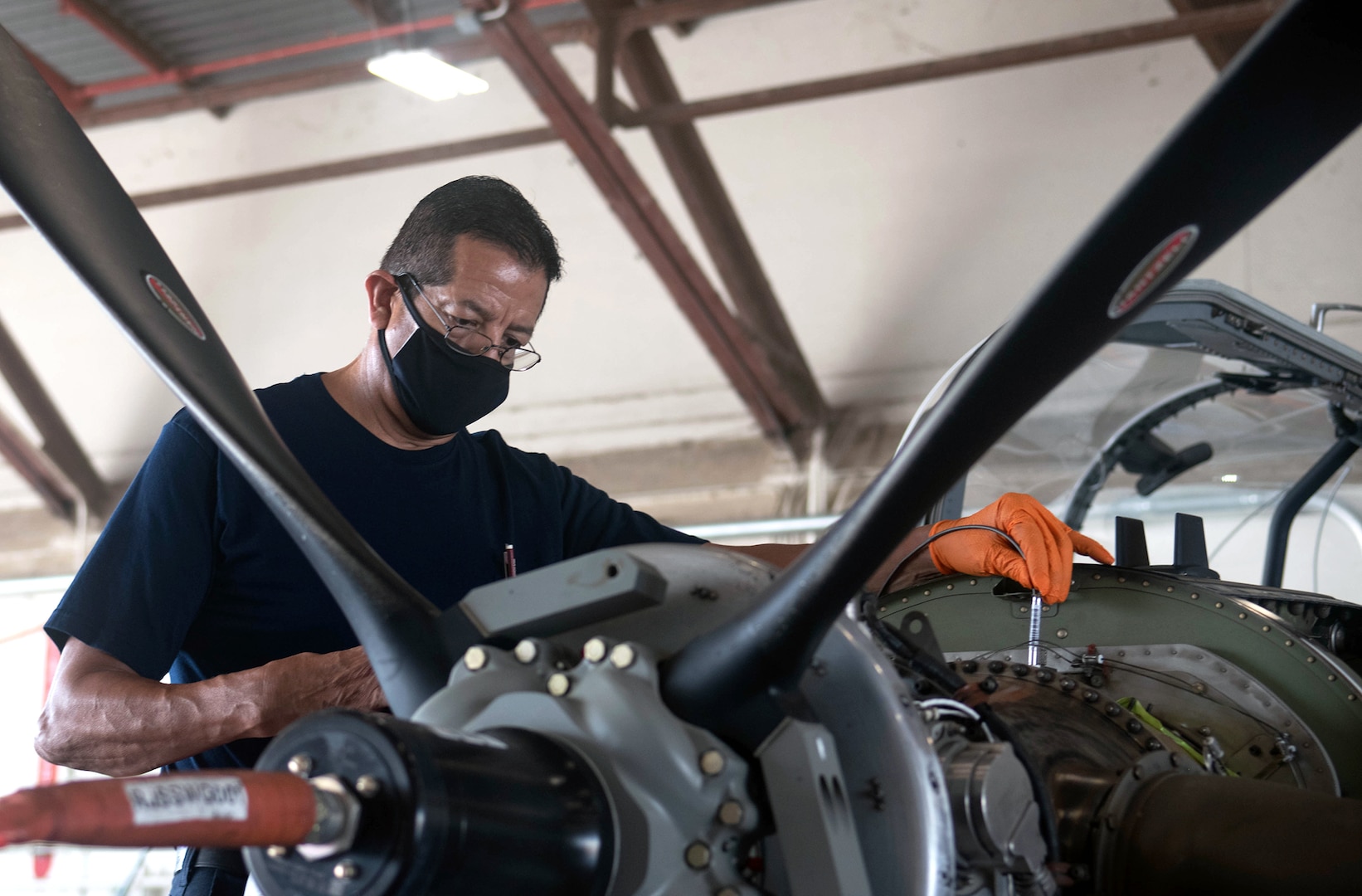 Roger Arredondo, T-6 Aircraft Maintenance Chief, conducts a regular aircraft control check at Joint Base San Antonio-Randolph July 14.