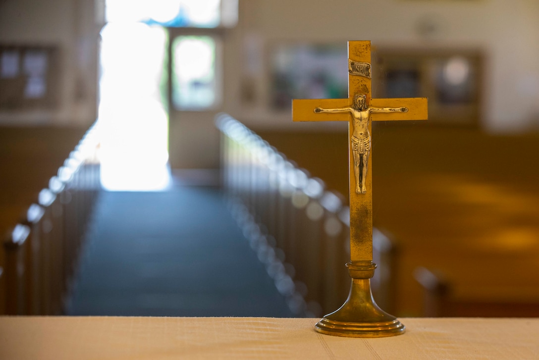 A crucifix waits on the altar at Marine Memorial Chapel on Marine Corps Base Camp Pendleton, California, June 3, 2020.  Pendleton’s Marine Memorial Chapel and Blinder Memorial Chapel are holding the first worship services this weekend since closing in response to the coronavirus pandemic earlier this year.  Several precautions have been taken to help mitigate the spread of disease during worship services. (Marine Corps photo by Lance Cpl. Andrew Cortez)