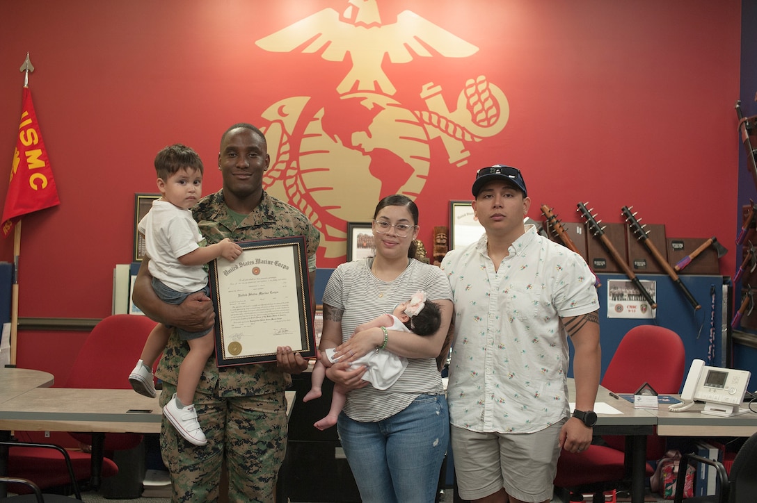 Marine Staff Sgt. Christopher Kelley poses with his family on June 1, 2020, after being promoted to his current rank. Kelley, 27, from Montgomery, Alabama, currently serves the local Myrtle Beach community as a canvassing recruiter. (U.S. Marine Corps photo by Sgt. Joseph Jacob)
