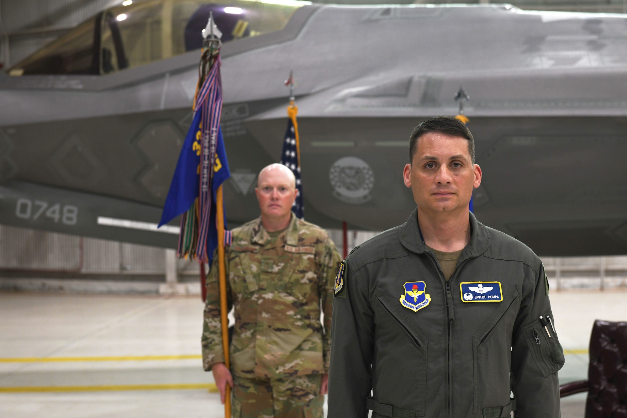 Air Force Col. Byron Pompa, incoming 33rd OG commander, stands in front of the audience during the 33rd OG change of command at Eglin Air Force Base, Florida, July 17, 2020. The 33rd OG commander is responsible for leading a 390-person group comprised of the 33rd Operations Support Squadron, the 337th Air Control Squadron, two intelligence formal training units, and the 58th Fighter Squadron. (U.S. Air Force photo by Airman 1st Class Heather Leveille)