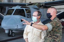 U.S. Marine Corps Col. Curtis Ebitz, right, commanding officer of Marine Corps Air Station New River, discusses aircraft capabilities with Congressman Greg Murphy, left, a member of the U.S. House of Representatives from North Carolina’s 3rd Congressional District, on MCAS New River, July 15, 2020. Murphy visited MCAS New River to receive an update on military construction from installation leaders and view hurricane related repairs to facilities and family housing currently in progress. (U.S. Marine Corps photo by LCpl. Christian Ayers)