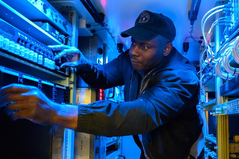 Photo of Equipment Specialist Winston Turner works on a Tactical Ground System at Joint Base Lewis-McChord