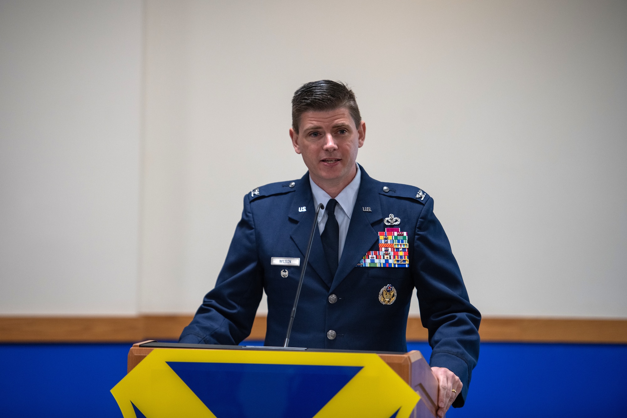 U.S. Air Force Col. Rockie Wilson, 37th Training Wing commander, addresses the audience during the change of command ceremony July 15, 2020