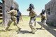 Senior Airman Ajay Cease, from left, Airman 1st Class Carlos Laboy Colon, and Airman Carolyn Raymond, members of the 66th Security Forces Squadron, participate in an active shooter exercise at Fort Devens, Mass., July 14. 66 SFS personnel participated in the training exercise to evaluate the installation’s readiness and emergency response capabilities. (U.S. Air Force photo by Todd Maki)