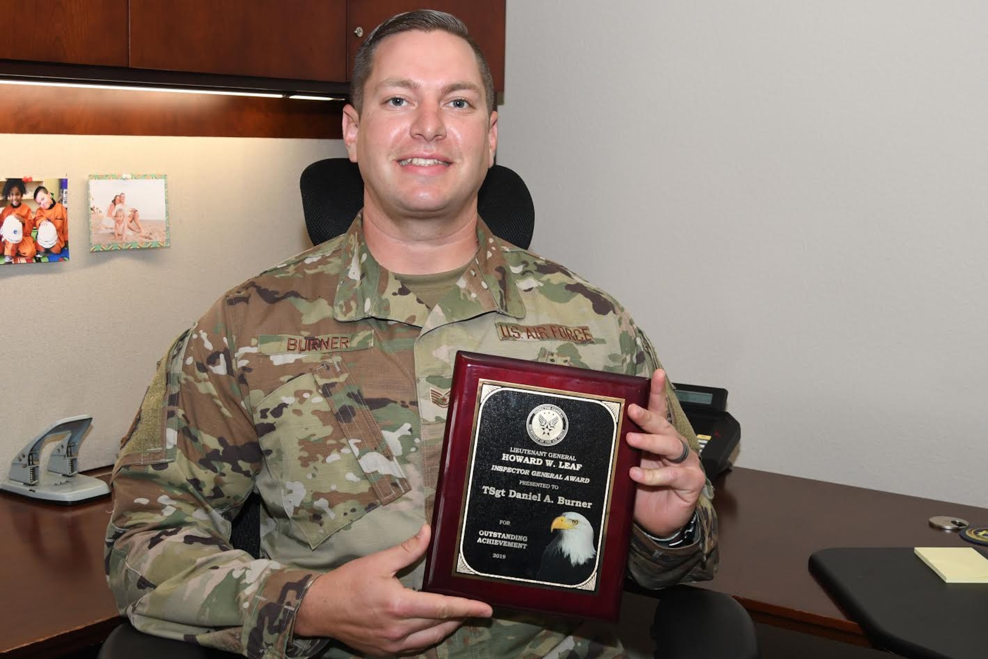 Tech Sgt. Daniel Burner, 30th Space Wing Inspector General inspection planner, poses for a photo with his award July 13, 2020, at Vandenberg Air Force Base, Calif. Burner’s continuous efforts to improve the 30th IG and the base, lead to him winning  the 2019 Lt Gen Howard W. Leaf Inspector General Award, for both the United States Space Force and United States Air Force (U.S. Air Force photo by Staff Sgt. Latonya Kim)