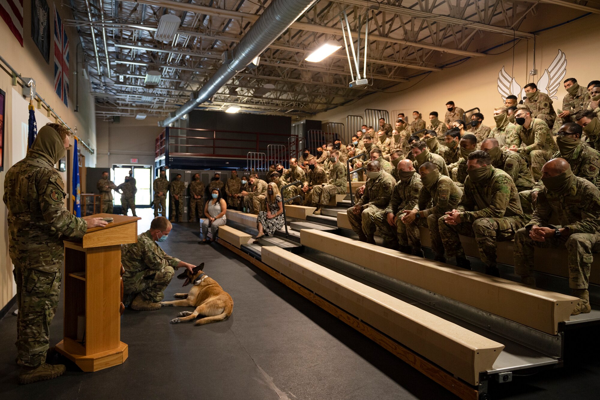 A photo of Airmen sitting in bleachers during a ceremony