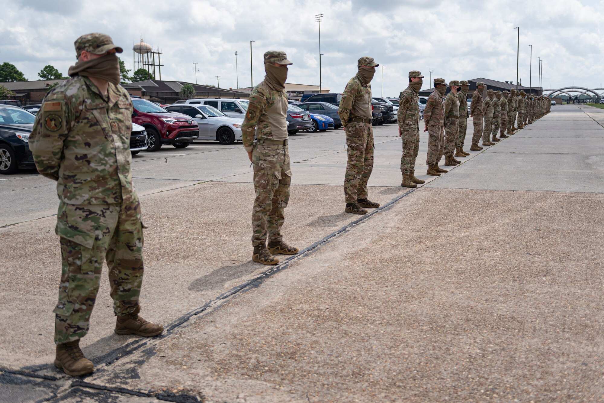 A photo of Airmen standing in line at parade rest