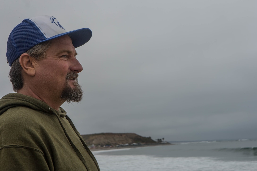 Darren Klassen, co-founder of Torrey Pines Surf Ministry, watches the waves at San Onofre Beach on Marine Corps Base Camp Pendleton, California, June 24, 2020. Klassen now works with more than four surf therapy organizations, with close ties to Marine Corps Base Camp Pendleton’s military population. (U.S. Marine Corps photo by Lance Cpl. Kerstin Roberts)