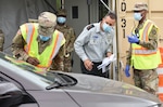 Lt. Col. Hai Rekah of the Israel Defense Forces Home Front Command, with members of the New York National Guard, observes intake procedures for motorists at the drive-thru test site at Glen Island Park in New Rochelle, N.Y., July 15, 2020. Rekah was in New York to meet with New York National Guard leaders to see parts of New York’s response to COVID-19, as Israel’s Homefront Command responds to the pandemic.