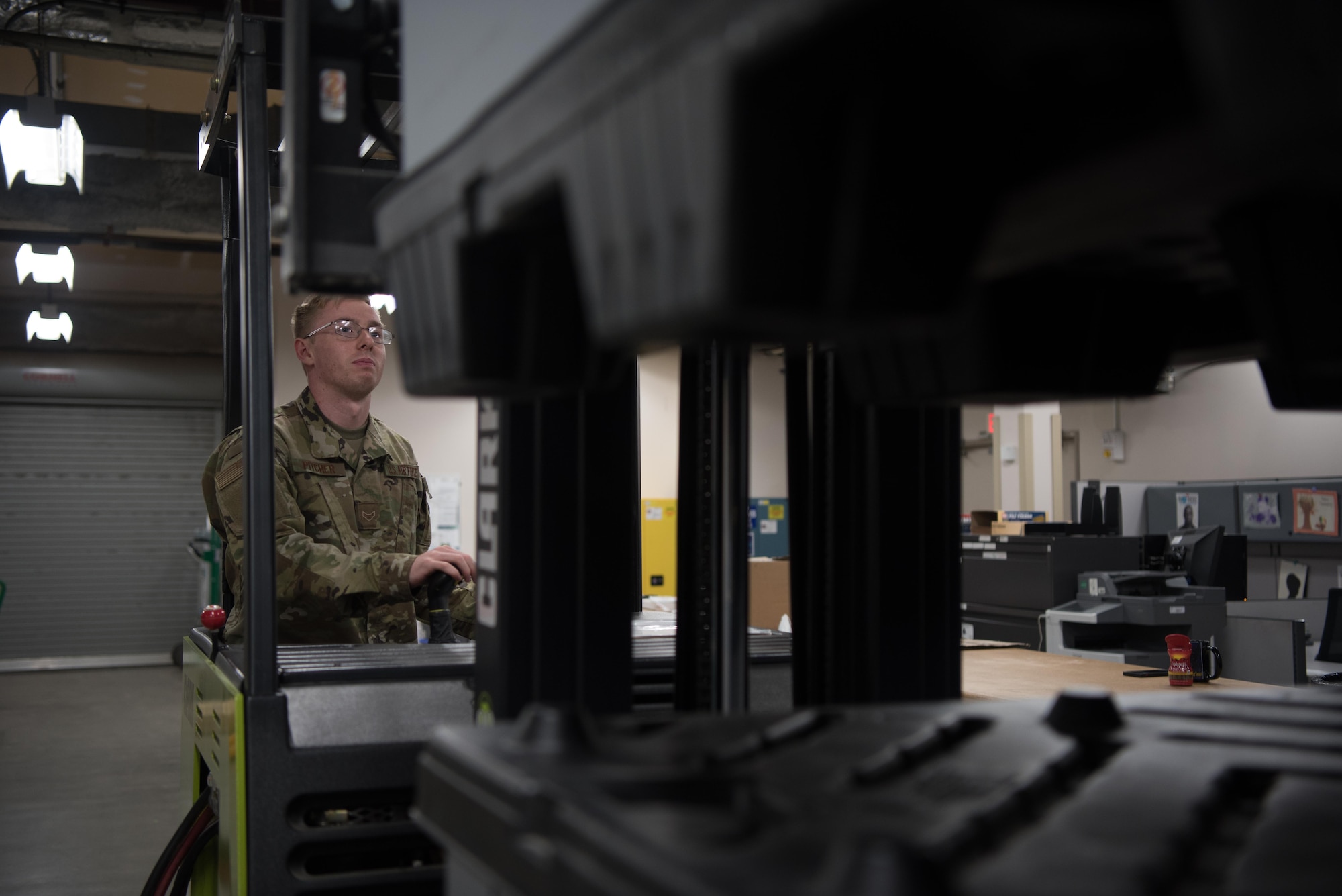 Airman 1st Class Bailey Pitcher, 22nd Medical Support Squadron acquisitions technician, uses a forklift to organize war reserve material July 15, 2020, at McConnell Air Force Base, Kansas. The Medical Logistics Flight prepares war reserve materials that may deploy during a time of war to Airmen that need them. (U.S. Air Force photo by Senior Airman Alexi Bosarge)