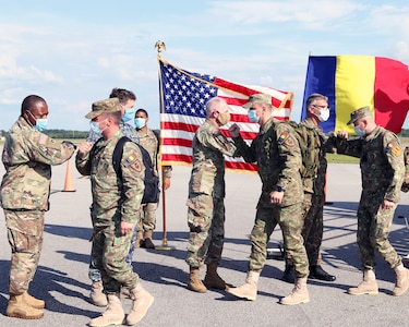 Members of the Alabama National Guard welcome a team of specialists from the Romanian Ministry of National Defense, comprised of ten medical personnel and five CBRN (chemical, biological, radiological, and nuclear) May 25, at Montgomery Aviation.