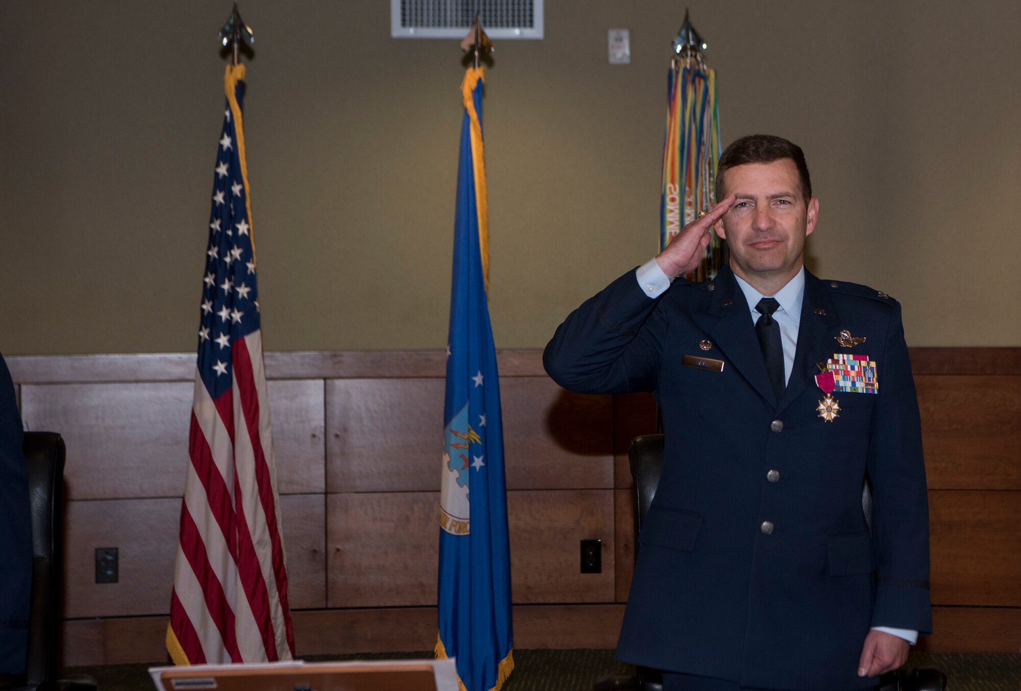 U.S. Air Force Col. Robert Davis renders a salute after receiving a Legion of Merit medal as he relinquishes command of the wing to U.S. Air Force Col. Travolis Simmons during the 3rd Wing change of command ceremony at Joint Base Elmendorf-Richardson, Alaska, July 17, 2020. The 3rd WG provides trained and equipped tactical air dominance forces, command and control platforms, and strategic and tactical airlift resources for contingency operations and also provides immediate early airborne detection, warning, surveillance and interception of hostile forces within the Alaskan North American Aerospace Defense Command Region. The ceremony was adapted to comply with COVID-19 health and safety measures.