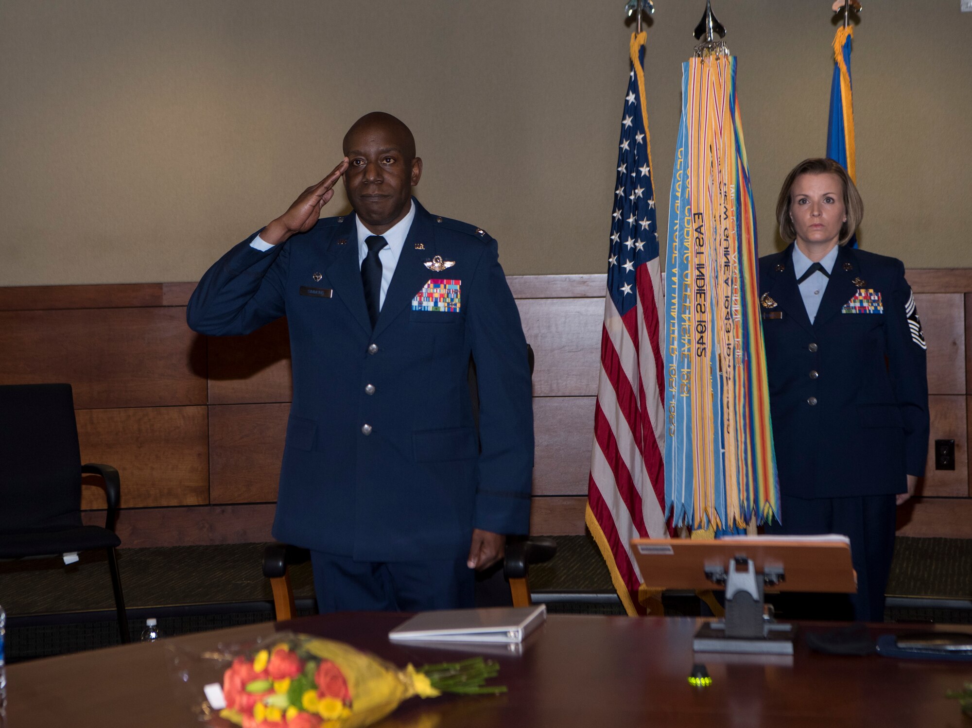 U.S. Air Force Col. Travolis Simmons renders his first salute as the new 3rd Wing commander during the 3rd WG change of command ceremony at Joint Base Elmendorf-Richardson, Alaska, July 17, 2020. The 3rd WG provides trained and equipped tactical air dominance forces, command and control platforms, and strategic and tactical airlift resources for contingency operations and also provides immediate early airborne detection, warning, surveillance and interception of hostile forces within the Alaskan North American Aerospace Defense Command Region. The ceremony was adapted to comply with COVID-19 health and safety measures.
