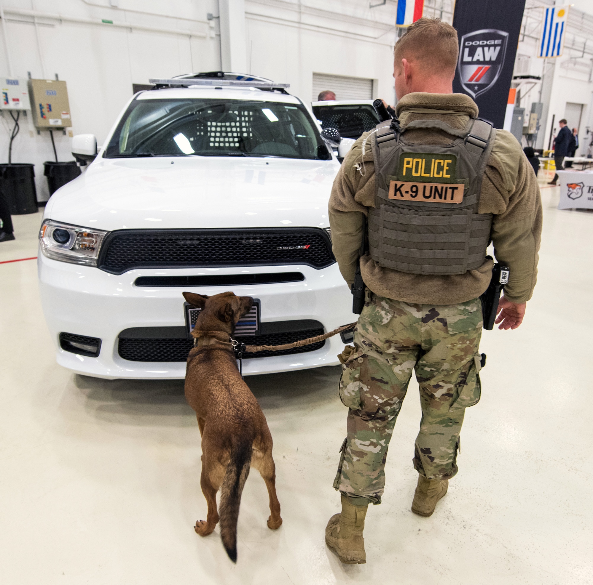 Air Force Staff Sgt. Tyler Evans, 802nd Security Forces Squadron, military working dog handler, and his dog Mika