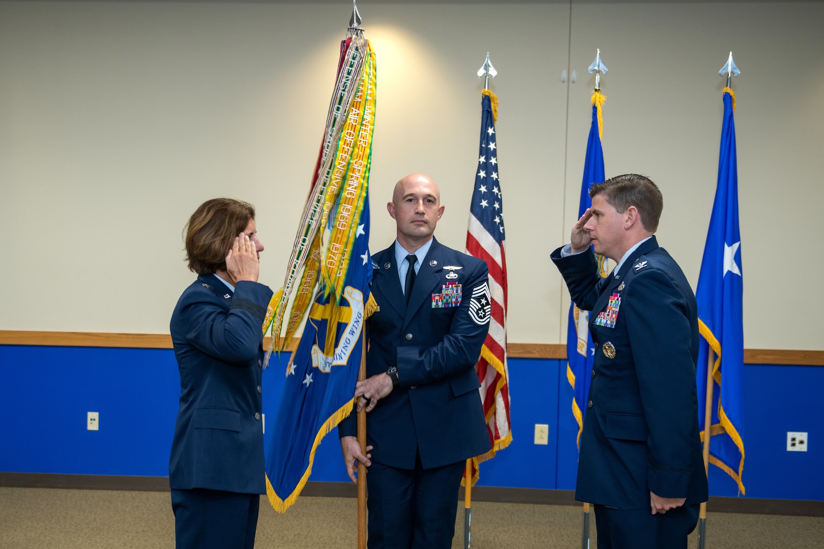 U.S. Air Force Col. Rockie Wilson (right), 37th Training Wing commander, salutes Maj. Gen. Andrea Tullos (left), Second Air Force commander, Keesler Air Force Base, Miss., after accepting command during the change of command ceremony July 15, 2020