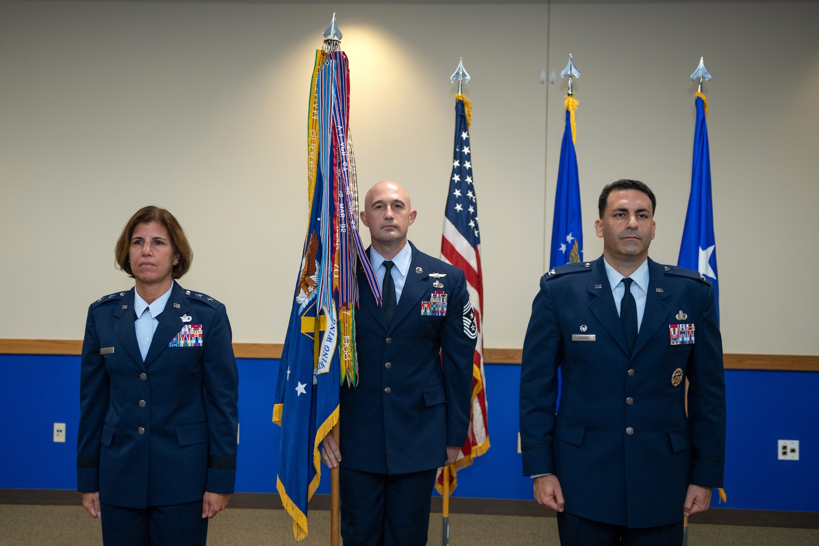 U.S. Air Force Maj. Gen. Andrea Tullos (left), Second Air Force commander and presiding officer, Keesler Air Force Base, Miss., and Col. Jason Janaros (right) stand at attention during the 37th Training Wing change of command ceremony July 15, 202