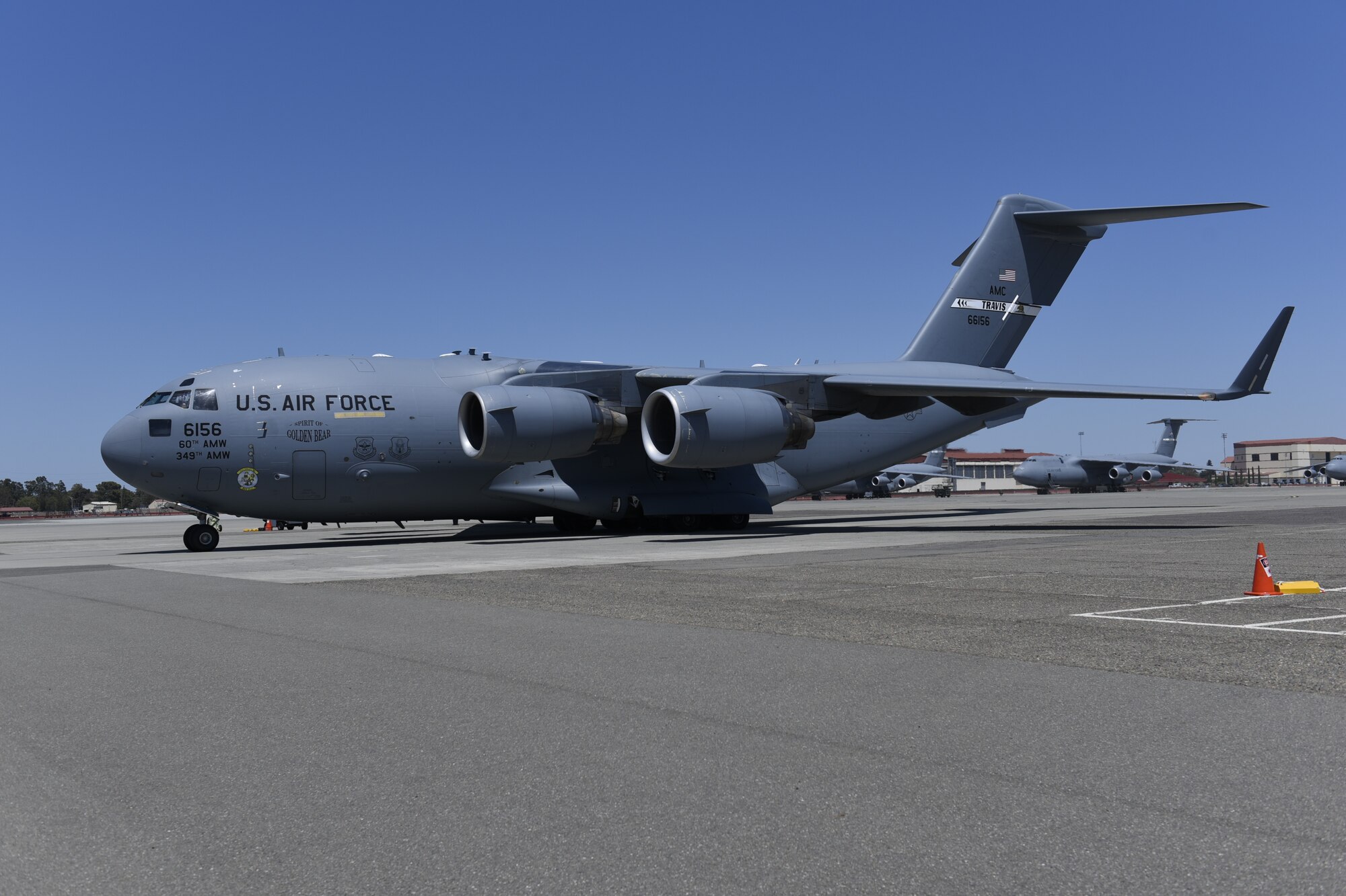 A C-17 Globemaster III with a COVID-19-positive patient onboard is parked on the flight line at Travis Air Force Base, California, July 17, 2020. Travis Airmen transported the patient from the Indo-Pacific Command area of responsibility as part of the Air Force’s response to the COVID-19 outbreak. This transport marked the Air Force’s first TIS mission into the INDOPACOM AOR and the 18th time employing TIS units to transport COVID-19 positive passengers. (U.S. Air Force photo by Airman 1st Class Cameron Otte)