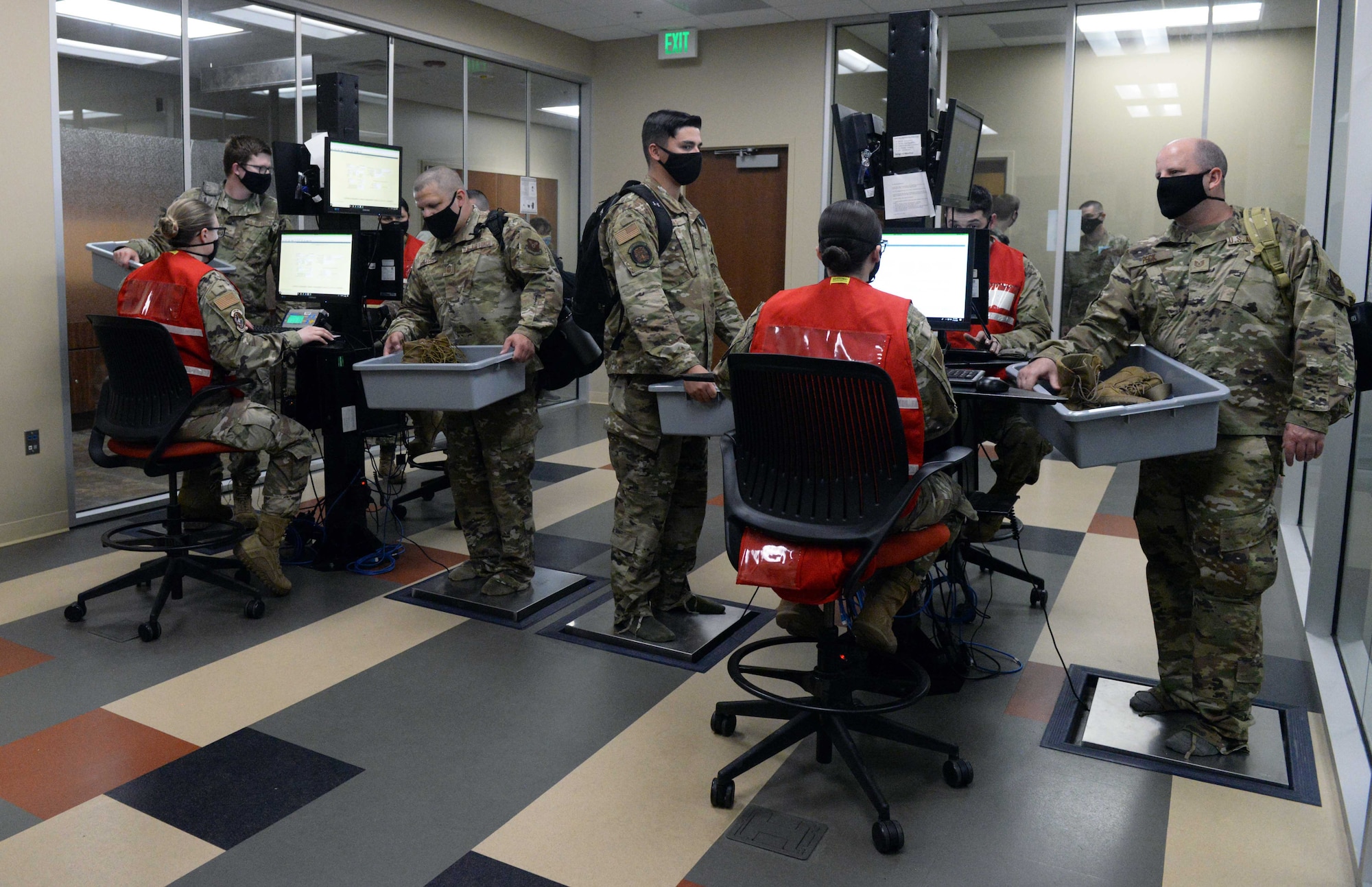 Airmen from the 28th Bomb Wing, Ellsworth Air Force Base, S.D., have their carry-on items X-rayed as part of a mobility processing line prior to a Bomber Task Force deployment to the U.S. Indo-Pacific Command area of responsibility July 13, 2020. The BTF mission demonstrates USINDOPACOM’s continued commitment to allies and partners in the Indo-Pacific Region. (U.S. Air Force photo by Airman 1st Class Quentin K. Marx)