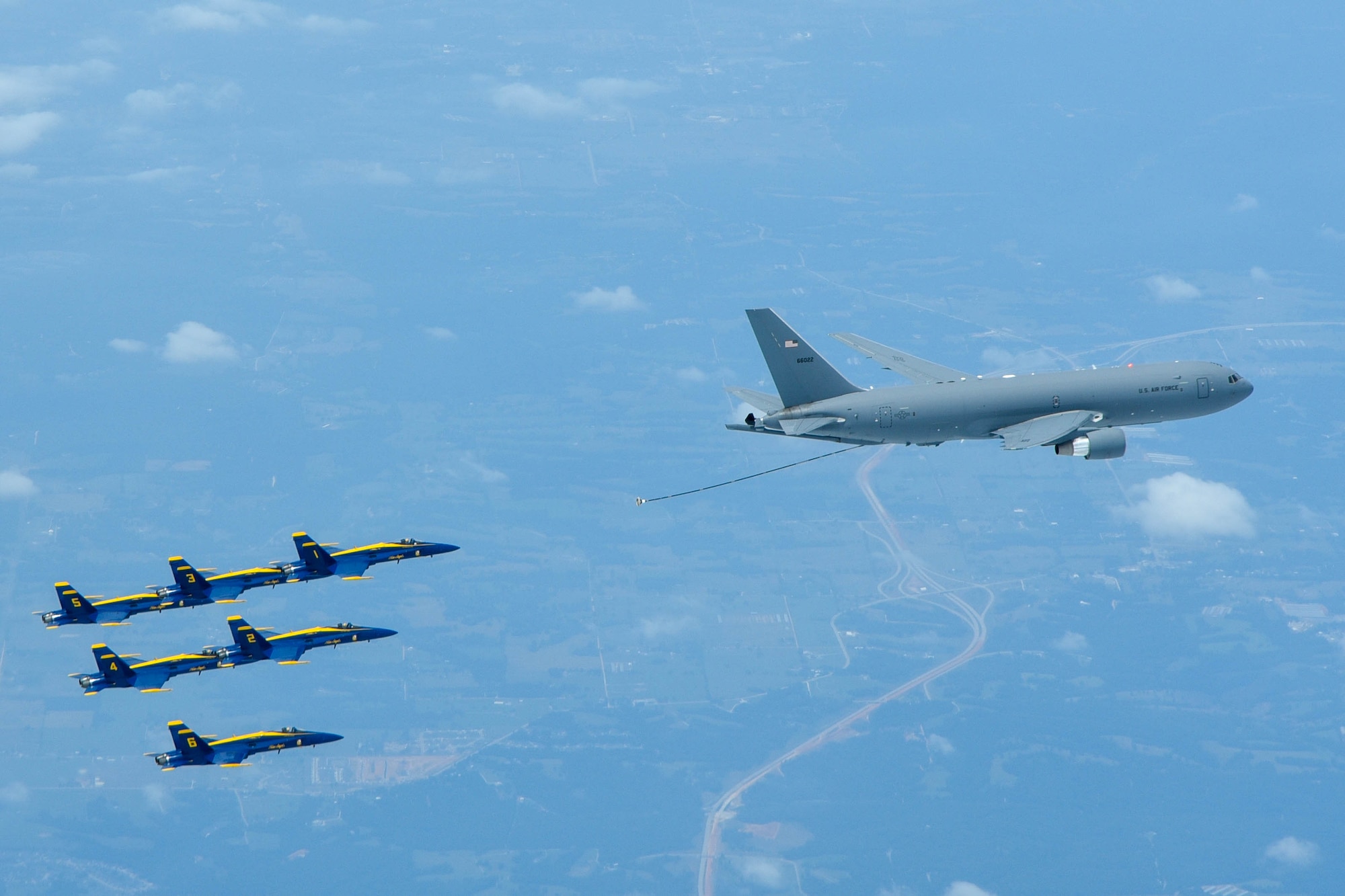 A KC-46 Pegasus assigned to the 931st Air Refueling Wing, McConnell Air Force Base, Kan., lines up to refuel an U.S. Navy Blue Angels F/A-18 Hornet, July 1, 2020 over South Dakota. This marks the first time the 931st ARW refueled the Blue Angels using a KC-46.