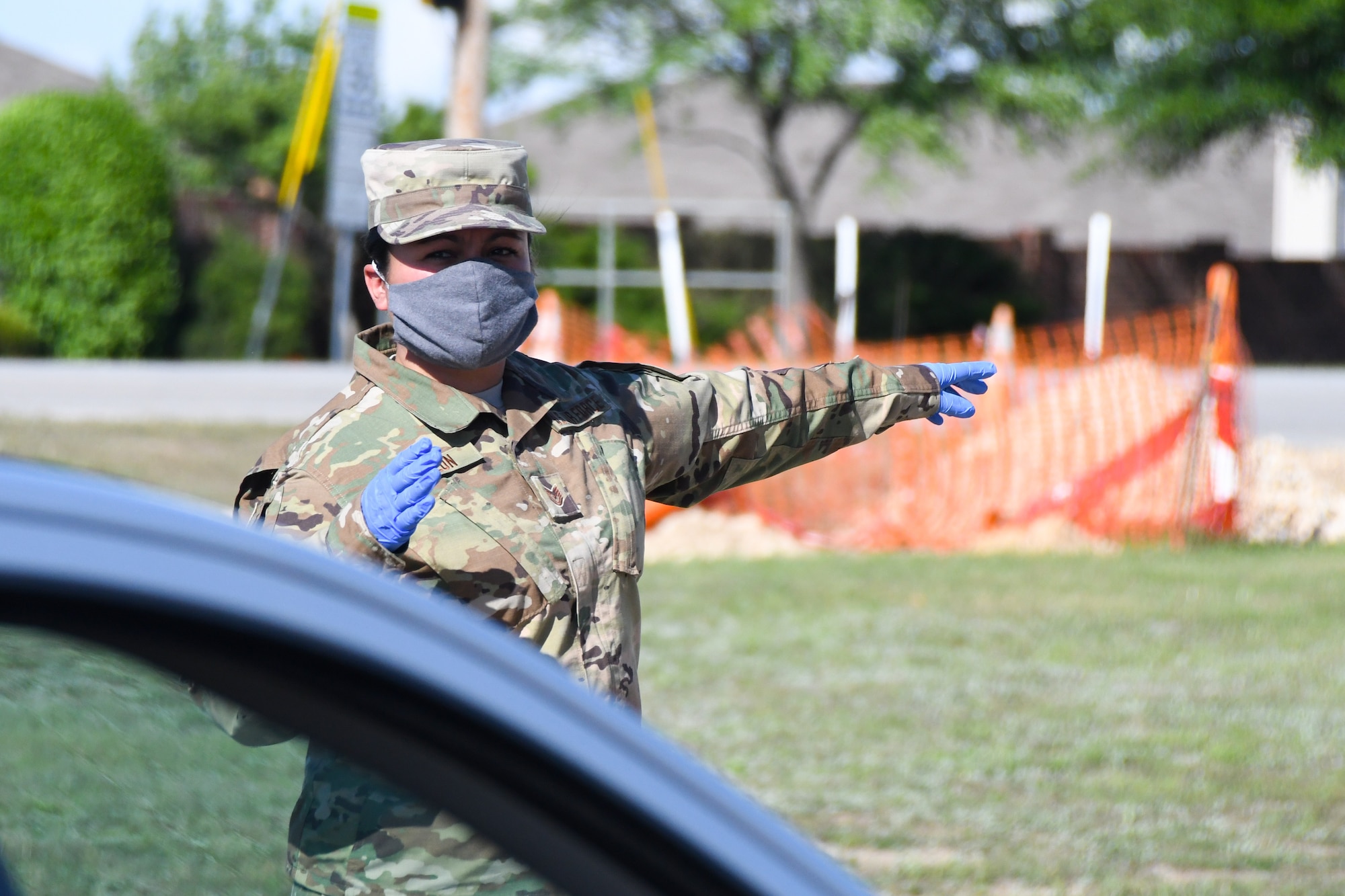 Citizen Airman directs traffic for provision distribution during COVID-19 response in Saginaw, Texas.