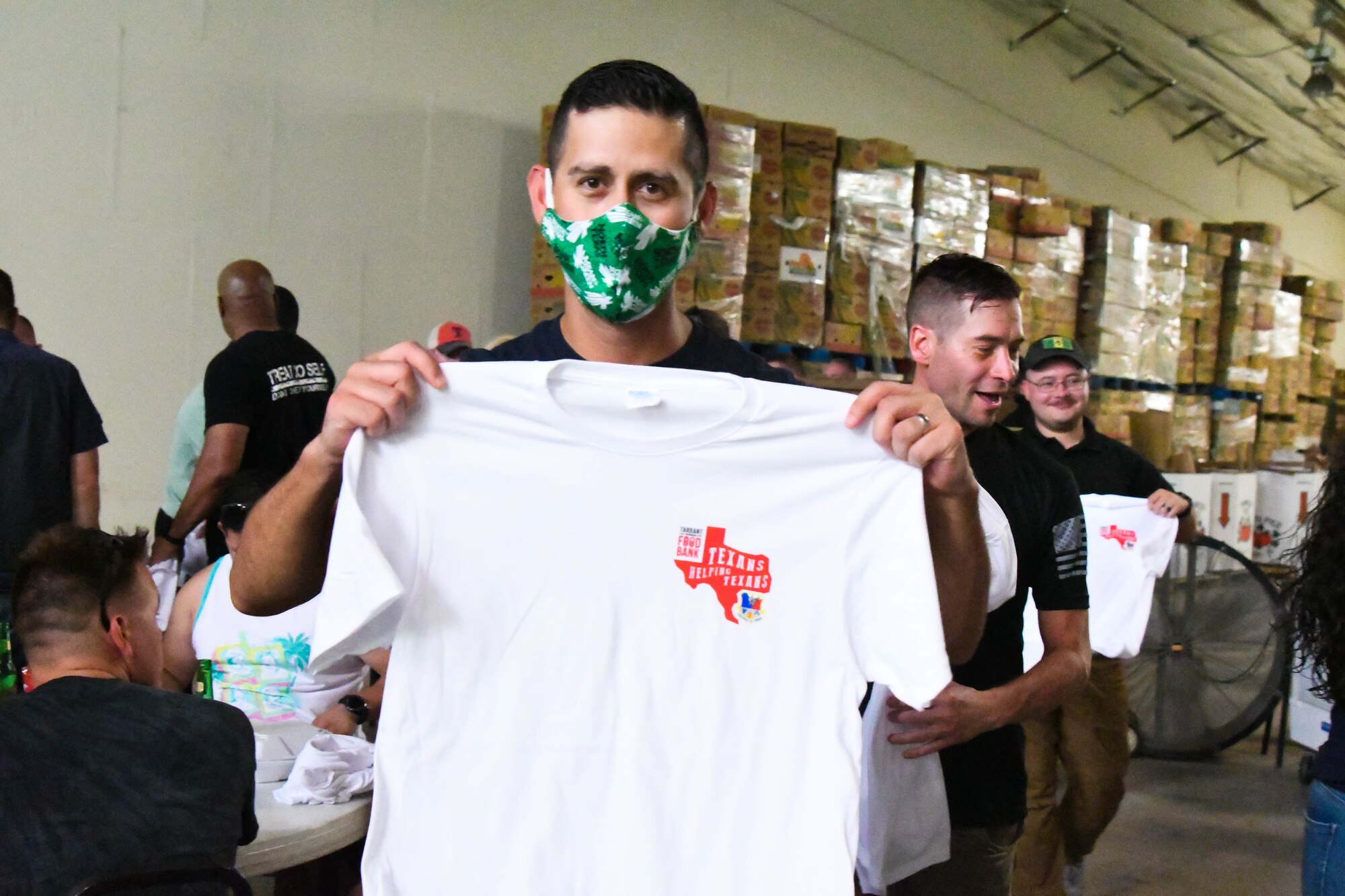 Citizen Airmen enjoy local food and complimentary t-shirts from Tarrant Area Food Bank.