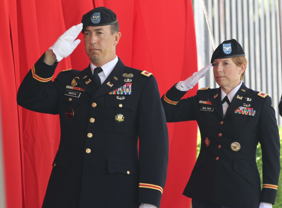 Col. Aaron Barta, left, outgoing commander of the U.S. Army Corps of Engineers Los Angeles District, and Col. Julie Balten, incoming commander, salute during a playing of the national anthem at the start of the LA District’s change of command ceremony July 14, 2020, at the LA District’s South El Monte Baseyard near Los Angeles. (Photo by Stephen Baack, U.S. Army Corps of Engineers Los Angeles District Public