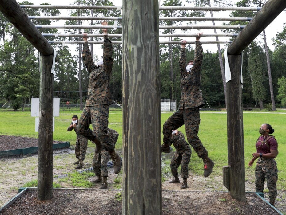 Recruits with Oscar Company, 4th Recruit Training Battalion, navigate an obstacle during the confidence course aboard Marine Corps Recruit Depot Parris Island, S.C., June 22, 2020. The Confidence Course is composed of various obstacles that both physically and mentally challenge recruits.