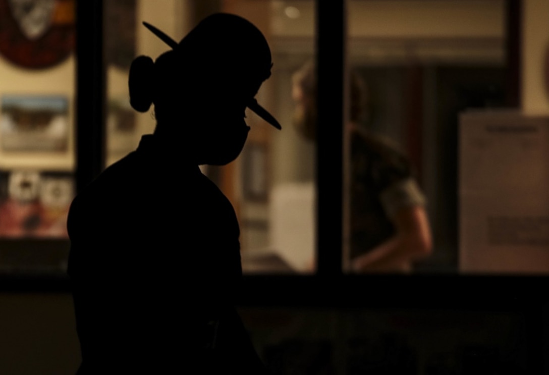 A drill instructor with Oscar Company, 4th Recruit Training Battalion, prepares to initiate "Lights" - the start of her platoon's morning routine - on Parris Island, S.C. July 7, 2020.