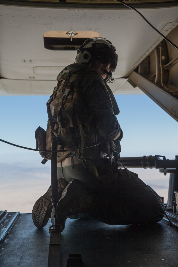 U.S. Marine Corps Cpl. Andrew McLaughlin, a crew chief with Marine Medium Tiltrotor Squadron 164 (Reinforced), 15th Marine Expeditionary Unit, adjusts an antenna attached to the rear gun mount in an MV-22B Osprey during beyond line of sight training in California, July 9, 2020. The BLOS training improved and expanded skills needed to facilitate communication between adjacent units or higher headquarters that are located beyond the horizon and cannot be physically seen. (U.S. Marine Corps photo by Lance Cpl. Brendan Mullin)