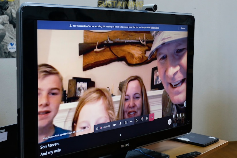 Col. Stephen P. Case and family pose from their home in Alabama after relinquishing command of the 209th Digital Liaison Detachment July 19, 2020. Col. Case attended the change of command ceremony virtually. The detachment, headquartered at U.S. Army Garrison Wiesbaden, is part of the U.S. Army Reserve’s 7th Mission Support Command and serves in direct support of U.S. Army Europe.  (U.S. Army Reserve photo by Staff Sgt. Chris Jackson/Released)